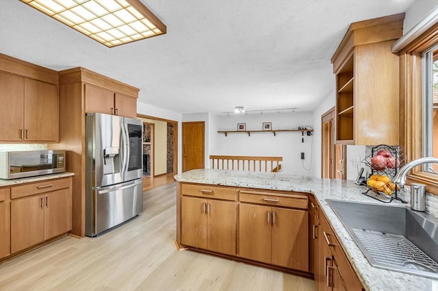 236 Williamsburg Dr, Longmeadow, MA 01106 - kitchen featuring appliances with stainless steel finishes, a sink, a peninsula, open shelves, and light wood-type flooring
