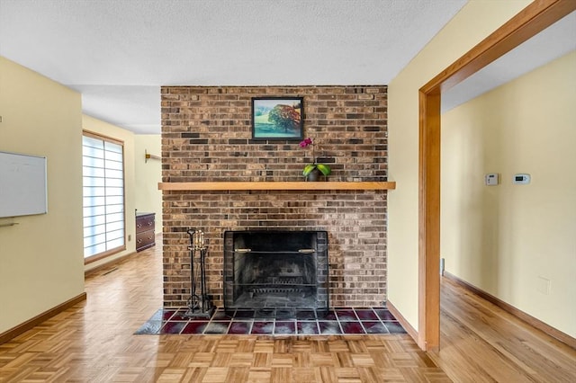 236 Williamsburg Dr, Longmeadow, MA 01106 - detailed view of baseboards, a fireplace, and a textured ceiling
