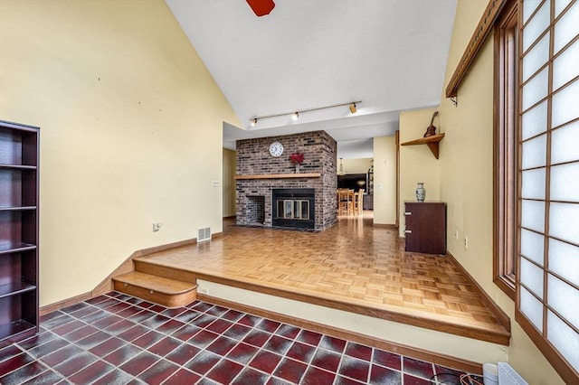 236 Williamsburg Dr, Longmeadow, MA 01106 - living room with a fireplace, rail lighting, baseboards, high vaulted ceiling, and a ceiling fan