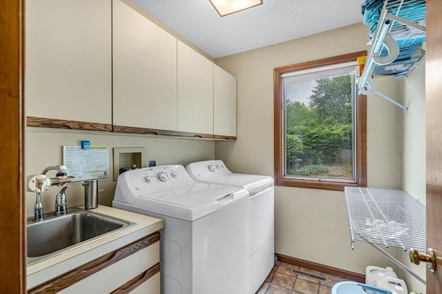 236 Williamsburg Dr, Longmeadow, MA 01106 - laundry area with cabinet space, washing machine and dryer, light tile patterned flooring, and baseboards