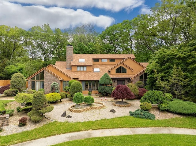 236 Williamsburg Dr, Longmeadow, MA 01106 - view of front facade featuring a chimney, brick siding, and roof with shingles