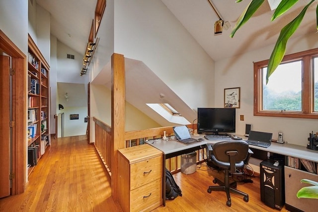 236 Williamsburg Dr, Longmeadow, MA 01106 - office area with a skylight, light wood-type flooring, track lighting, and high vaulted ceiling
