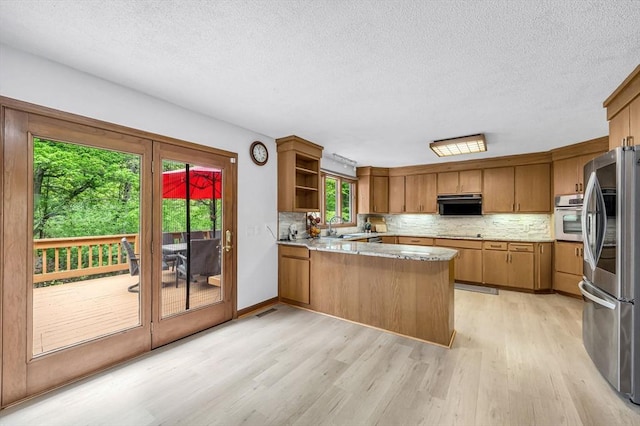 236 Williamsburg Dr, Longmeadow, MA 01106 - kitchen featuring stainless steel appliances, a peninsula, light wood-style floors, a textured ceiling, and open shelves