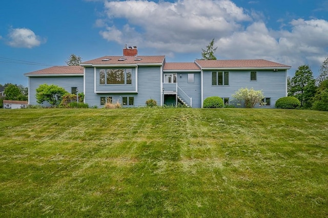 21 Nourse St, Westborough, MA 01581 - rear view of property with a chimney and a yard