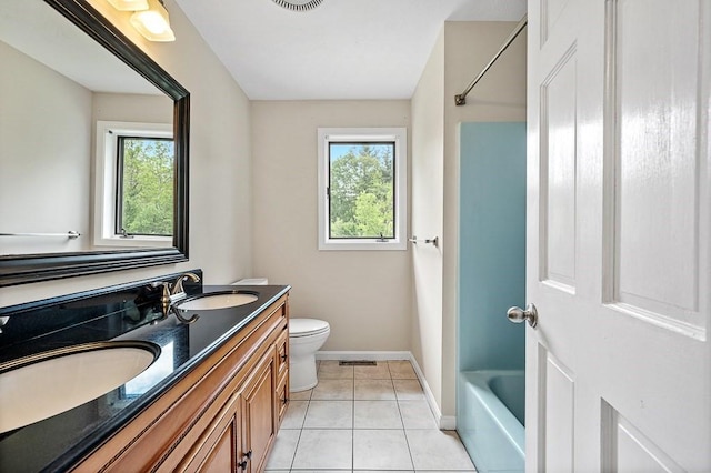 21 Nourse St, Westborough, MA 01581 - bathroom featuring healthy amount of natural light, double vanity, toilet, and tile patterned flooring