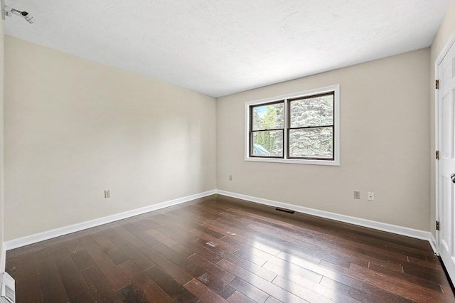 21 Nourse St, Westborough, MA 01581 - empty room with baseboards and dark wood-type flooring