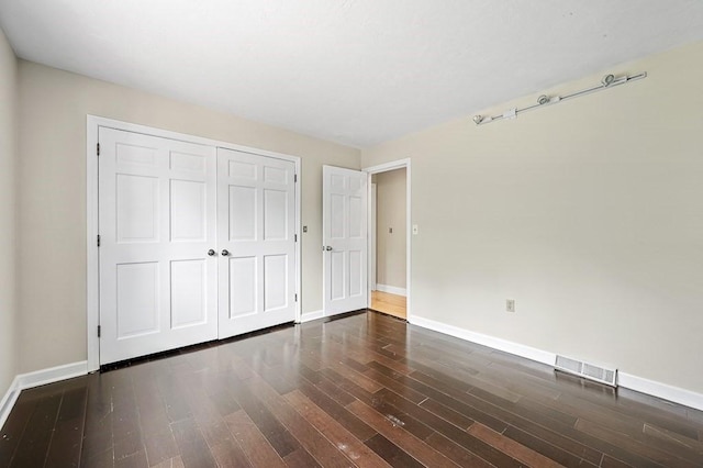 21 Nourse St, Westborough, MA 01581 - unfurnished bedroom featuring baseboards, wood finished floors, and a closet
