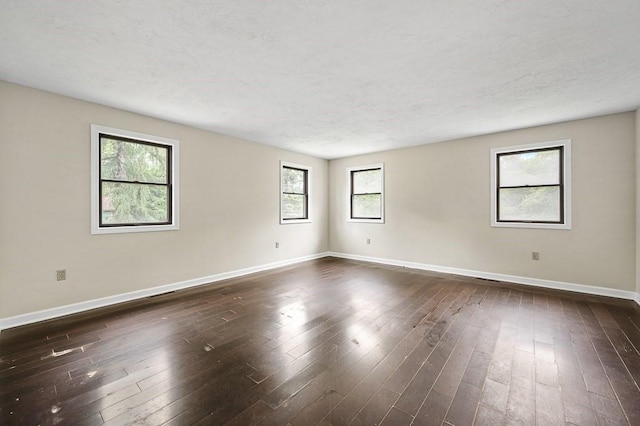 21 Nourse St, Westborough, MA 01581 - spare room with baseboards and dark wood-style floors