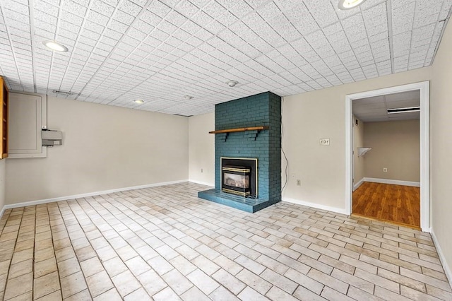 21 Nourse St, Westborough, MA 01581 - unfurnished living room with baseboards, a fireplace, and recessed lighting