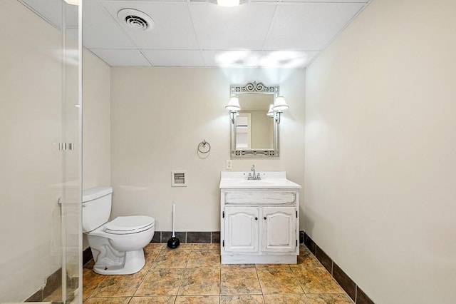 21 Nourse St, Westborough, MA 01581 - full bath with baseboards, vanity, a drop ceiling, toilet, and a shower with door