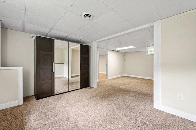 21 Nourse St, Westborough, MA 01581 - below grade area with carpet flooring, a paneled ceiling, and baseboards
