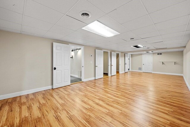 21 Nourse St, Westborough, MA 01581 - unfurnished room featuring wood finished floors, baseboards, and a drop ceiling