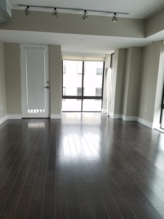 empty room featuring dark hardwood / wood-style floors