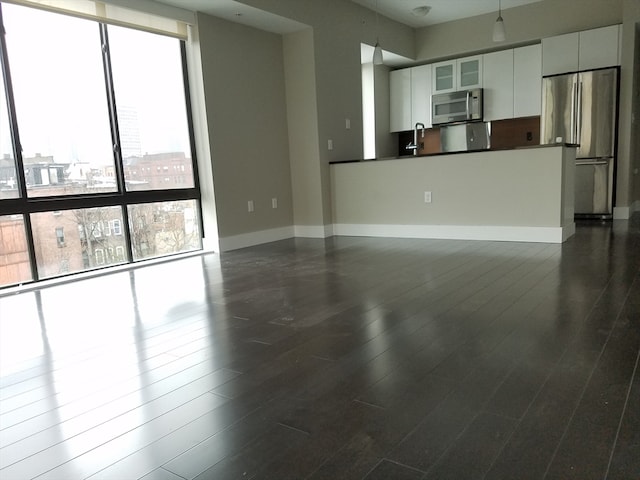 interior space with sink and dark wood-type flooring