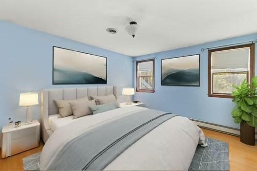 120 Hatchfield Dr, Brockton, MA 02301 - bedroom featuring wood finished floors and a baseboard radiator