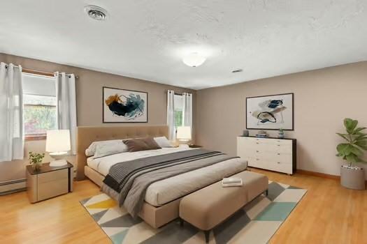 120 Hatchfield Dr, Brockton, MA 02301 - bedroom with multiple windows, light wood-style floors, and baseboard heating