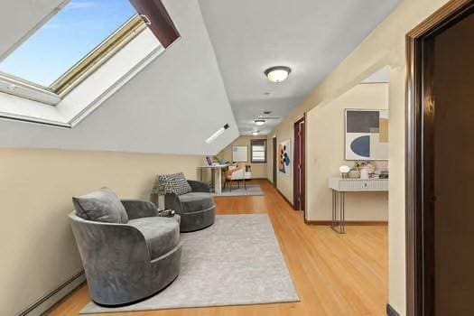 120 Hatchfield Dr, Brockton, MA 02301 - sitting room featuring baseboard heating, light wood-style floors, a skylight, and vaulted ceiling