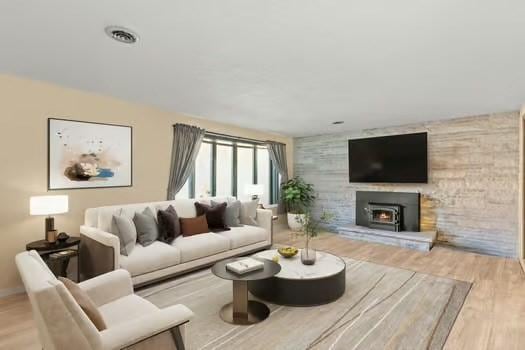 120 Hatchfield Dr, Brockton, MA 02301 - living area with a warm lit fireplace and wood finished floors