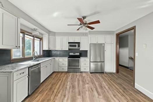 120 Hatchfield Dr, Brockton, MA 02301 - kitchen featuring appliances with stainless steel finishes, a sink, ceiling fan, and white cabinetry