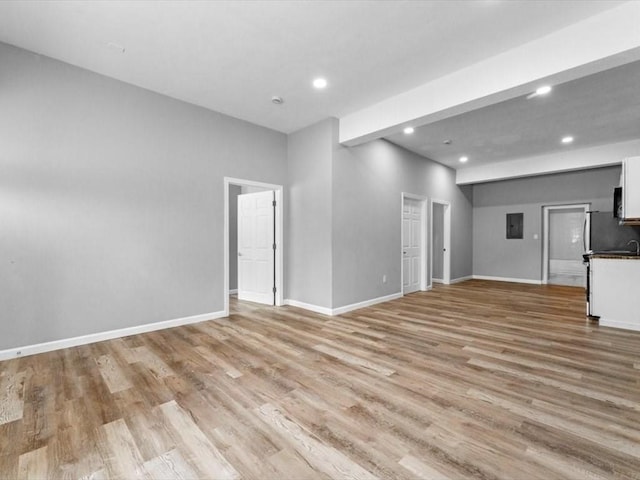 273 Elm St, Southbridge, MA 01550 - unfurnished living room with recessed lighting, light wood finished floors, and electric panel