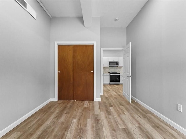 273 Elm St, Southbridge, MA 01550 - empty room with light wood finished floors and baseboards
