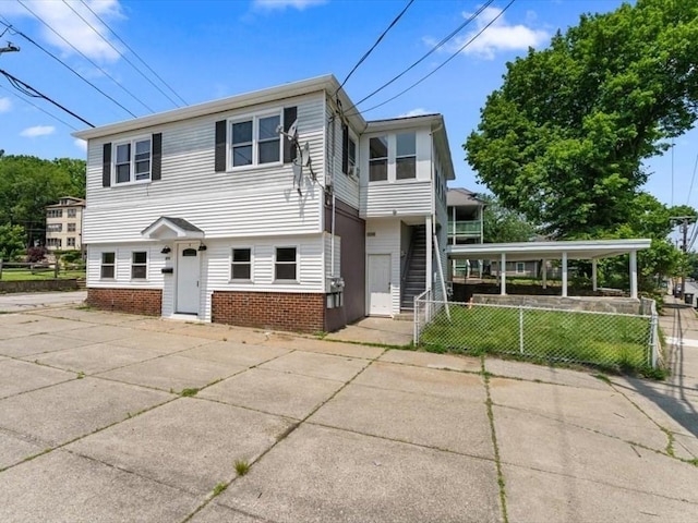 273 Elm St, Southbridge, MA 01550 - view of front of house with brick siding and stairs