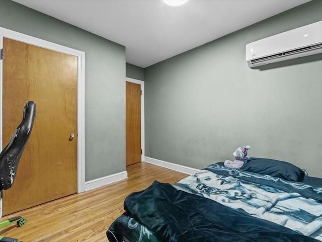 273 Elm St, Southbridge, MA 01550 - bedroom with a wall unit AC and wood finished floors