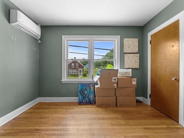 273 Elm St, Southbridge, MA 01550 - unfurnished room with an AC wall unit and wood finished floors