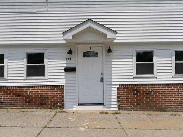 273 Elm St, Southbridge, MA 01550 - property entrance featuring brick siding