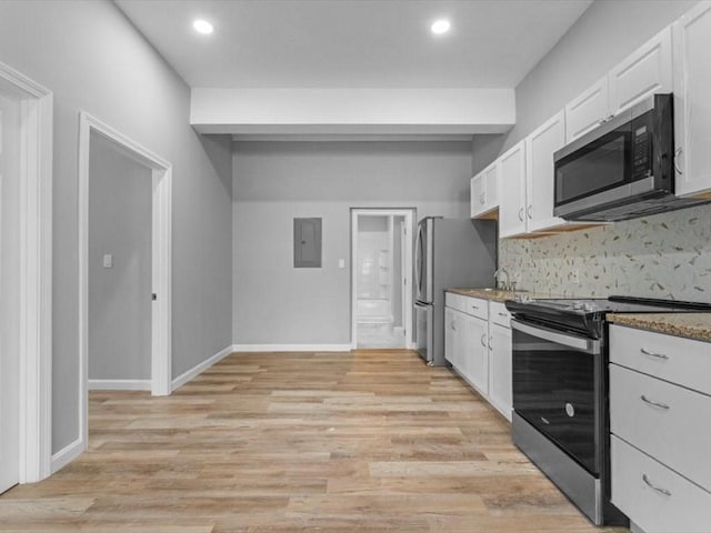 273 Elm St, Southbridge, MA 01550 - kitchen with stainless steel appliances, electric panel, white cabinets, recessed lighting, and light wood-style flooring
