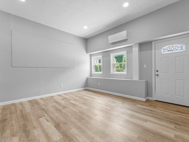 273 Elm St, Southbridge, MA 01550 - foyer entrance with a wall mounted AC, wood finished floors, and recessed lighting
