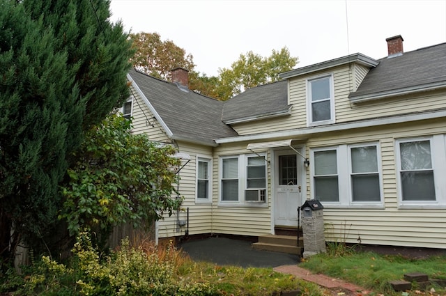 view of front of home with cooling unit