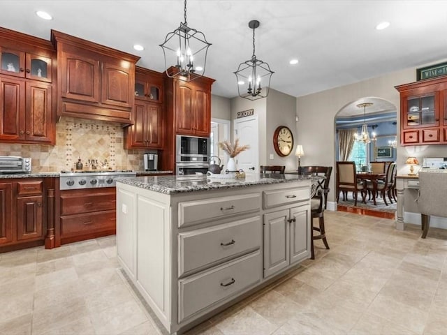 35 Oxbow Dr, Wrentham, MA 02093 - kitchen featuring a chandelier, stainless steel appliances, recessed lighting, a center island, and decorative backsplash