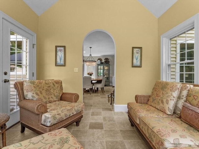 35 Oxbow Dr, Wrentham, MA 02093 - tiled living room with a chandelier, high vaulted ceiling, and arched walkways