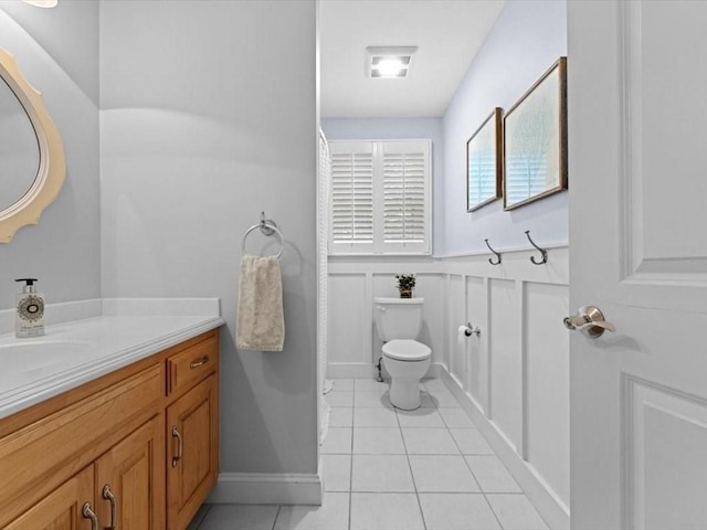 35 Oxbow Dr, Wrentham, MA 02093 - bathroom featuring vanity, tile patterned flooring, and a wainscoted wall