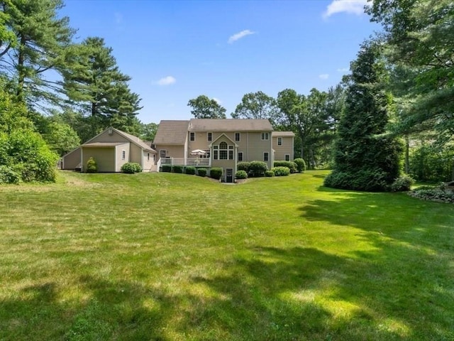 35 Oxbow Dr, Wrentham, MA 02093 - rear view of house featuring a detached garage and a yard
