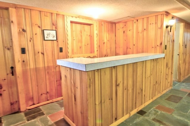 31 Lee Ave, Fitchburg, MA 01420 - bar area featuring wood walls and a textured ceiling