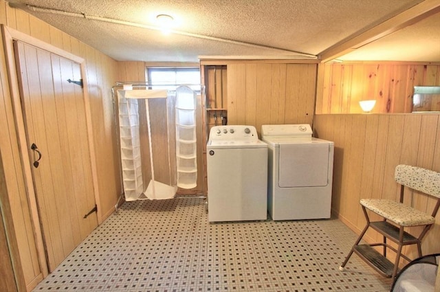 31 Lee Ave, Fitchburg, MA 01420 - washroom featuring separate washer and dryer, wooden walls, tile patterned floors, and a textured ceiling