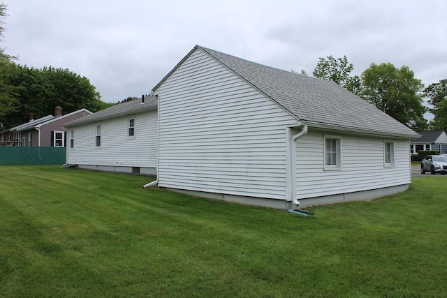 31 Lee Ave, Fitchburg, MA 01420 - view of side of home featuring roof with shingles and a lawn