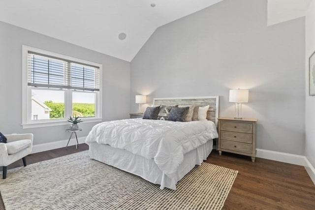 bedroom with dark hardwood / wood-style flooring and lofted ceiling