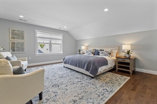 bedroom featuring dark hardwood / wood-style floors and lofted ceiling