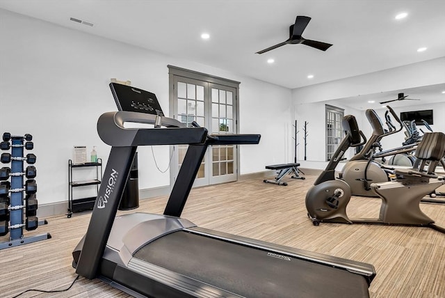 exercise area with ceiling fan and french doors