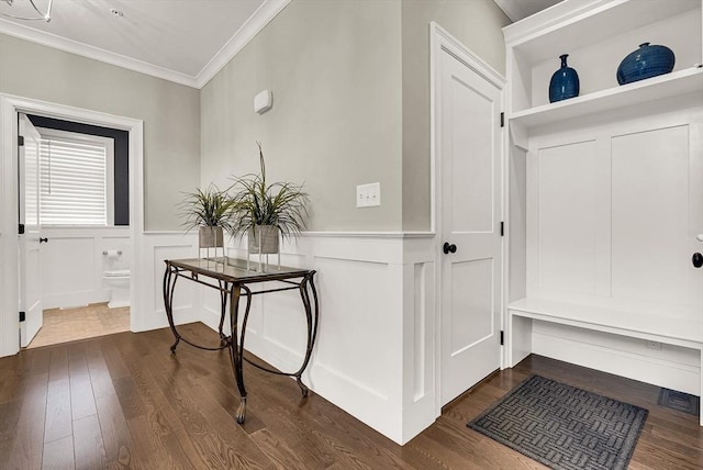 interior space with ornamental molding and dark wood-type flooring