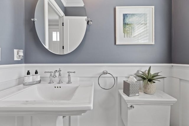 bathroom featuring sink and toilet