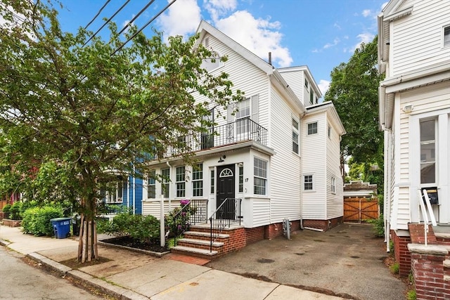 17 Perry St, Somerville, MA 02143 - view of front of property with a balcony and driveway