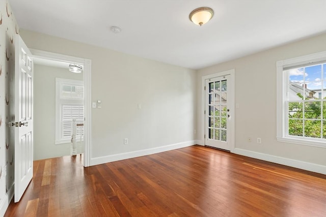 17 Perry St, Somerville, MA 02143 - spare room featuring wood finished floors and a smoke detector