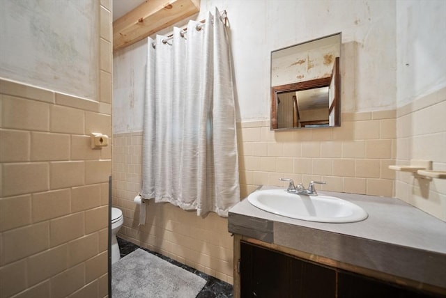 8 Ward St, Salem, MA 01970 - bathroom with tile walls, vanity, and a wainscoted wall