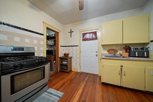 8 Ward St, Salem, MA 01970 - kitchen with appliances with stainless steel finishes, cream cabinetry, wood-type flooring, and light countertops