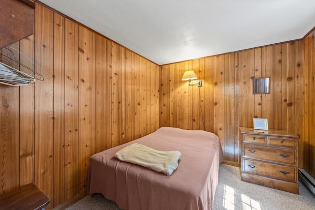 bedroom with carpet flooring and wooden walls