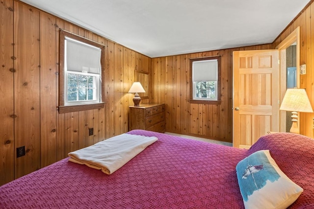 bedroom with wooden walls